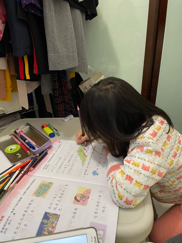 Assisting a kid who is from Primary 1 who studies in Munsang College Primary School with her homework and prepare for her English dictation.
